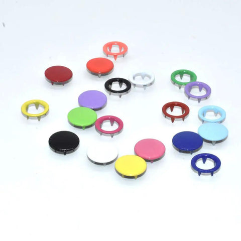Close-up of colorful metal eyelets from 200 Piece Snap Fastener Tool Kit With 10 Color Options Solid And Hollow 9.5mm Metal Eyelets