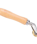 Steel seam roller with wooden handle and swiveling metal bracket; brass wheel for roofing membranes