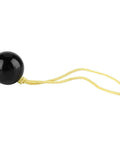 Arborist Retriever Ball Rope Friction Saver For Tree Work, black plastic climbing ball with attached yellow rope accessory.