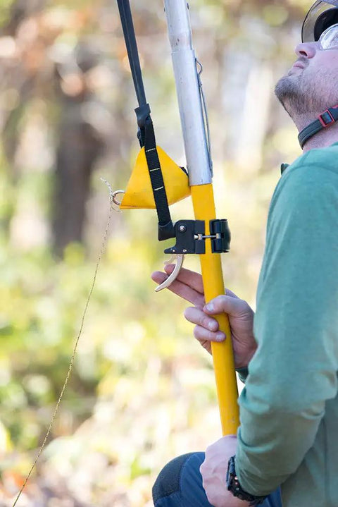 Man using Big Shot Trigger For Smoother Launching And Snappier Line Setting With A Quick Mid Pole Attachment outdoors