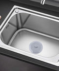 TKOWTB Bathtub Drain Stopper Silicone Drain Plug with Strong Suction Seal placed in a stainless steel sink.