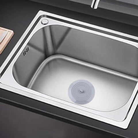 TKOWTB Bathtub Drain Stopper Silicone Drain Plug with Strong Suction Seal placed in a stainless steel sink.