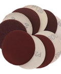 Get Your Tools Ready With This Sick Set of 100 Flocking Sandpaper Discs Perfect For Angle Grinders And Buffers Featuring Heavy Duty Hook Loop Design In 4 Inch Size Ranging From Rough To Fine Abrasives Like 60 Grit For Super Polishing And Smoothing Jobs. Displayed are various grit 4 inch flocking sandpaper discs in a circular arrangement.