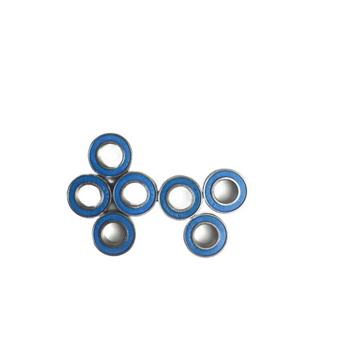 Seven 4x10x4 Millimeter ABEC-3 RC Car Bearing Kit, blue sealed 2RS ball bearings arranged in a cluster on white background