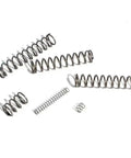 Badass 5 Pack Stainless Steel Compression Springs 20mm Long With 2.2mm Wire Gauge arranged on a white surface, showcasing their durability.