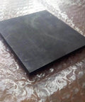Beefy High Temp Graphite Plate For Pyrolysis Block And Anode on bubble wrap, 100x100x35mm, anti-corrosion heat sink, high purity, conductive