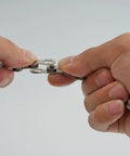 Hands demonstrating use of All In One Bike Chain Kit With 126 Links For 6/7/8 Speed Chains, Built In Chain Tool, Replacement Set For Hub Motor E Bikes