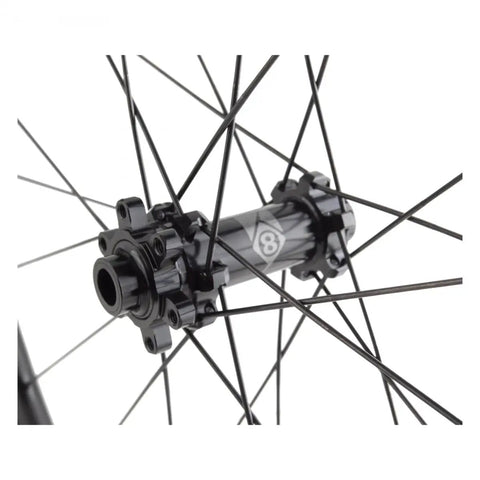 Close-up of the hub and spokes of a 700C Carbon Road Disc Wheel Set With Tubeless Ready Double Wall Rims OR8 Bolt On Compatible.
