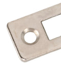 Close-up of a stainless steel piece from the 10 Pack Cabinet Door Magnetic Catch Set Heavy-Duty Magnetic Seal for cabinets.
