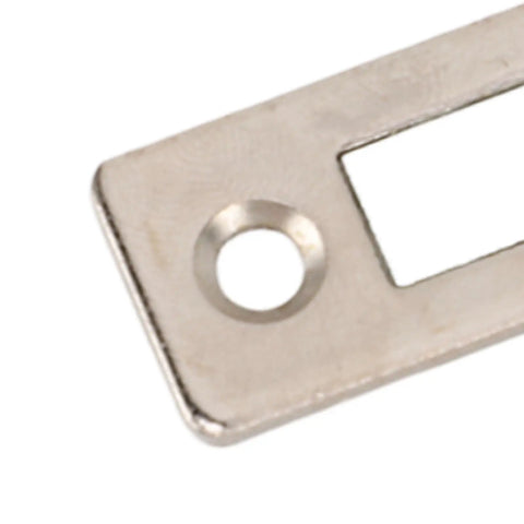 Close-up of a stainless steel piece from the 10 Pack Cabinet Door Magnetic Catch Set Heavy-Duty Magnetic Seal for cabinets.