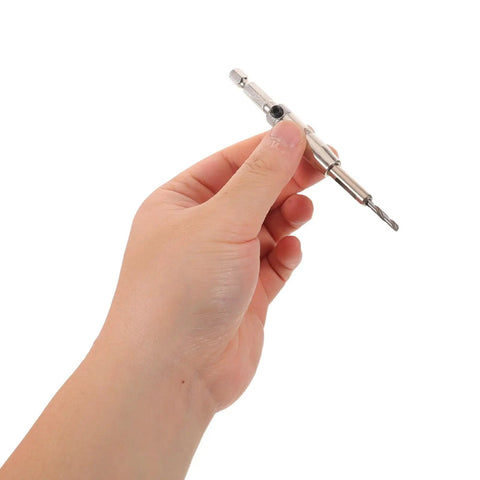 Get Your Hinge Drilling Game Strong With This 4Pc Self Centering Drill Bit Kit held in hand, showcasing its steel construction for precise fittings.