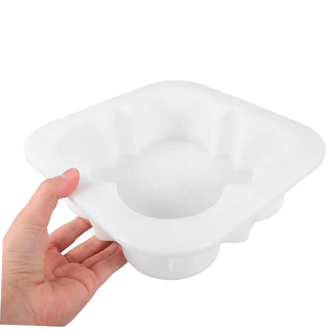 Hand holding a white Concrete Paver Mold Kit for Pathways and Patios, Reusable DIY Friendly PP Molds for Home and Garden