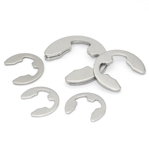 Close-up of stainless steel E-clips from the 200 Piece E Clip Circlip Washer Set Kit Stainless Steel 304 External Snap Rings For Shafts 1.2 To 15 Mm M1.5 To M10 Range Durable Rust Resistant Great For Machinery DIY Projects And Automotive Hardware, showing different sizes and smooth finish.