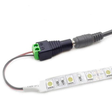 Close-up of LED strip connected to a 12V DC Power Supply For LED Strips 2A 24W Switching Adapter with barrel connector