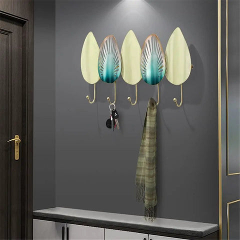 Heavy Duty Iron Wall Mounted Coat Hooks And Scarf Organizer With Sleek Geometric Lines, four hooks holding keys and a scarf.