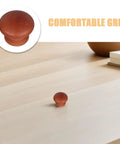 8 Pack Wood Dresser Knobs With Classic Brown Tone Provide Quick Cabinet And Drawer Handle Replacement To Instantly Liven Up Your Kitchen Or Bedroom With Effortless Setup And Timeless Vintage Vibes, showcasing a round wooden knob on a light wooden surface.