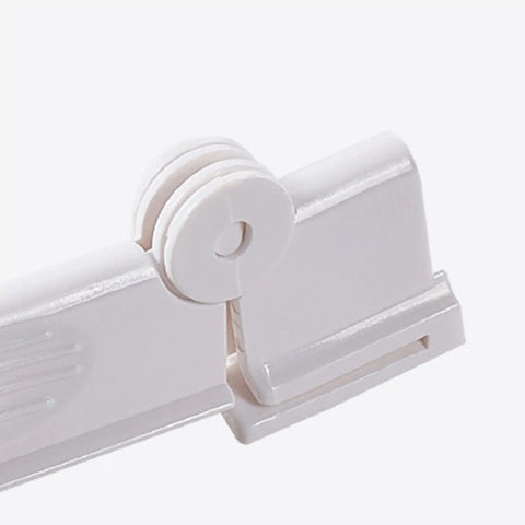 2X Clear Milk Carton Sealing Clips Keep Boxed Drinks Fresh And Prevent Messy Spills In Dorms, Studios, And Kitchens. Close-up of white plastic clip with locking mechanism.