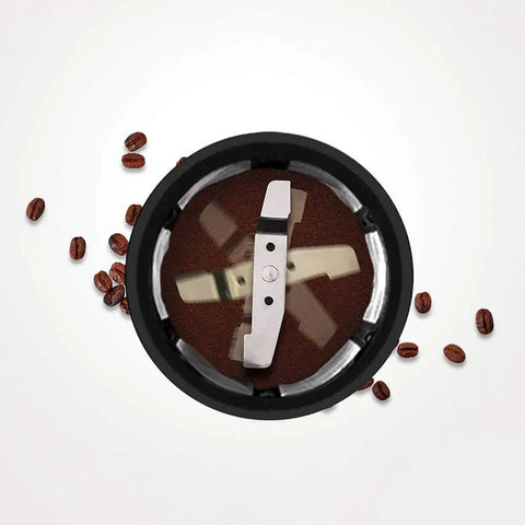 Kickstart Your Daily Grind With This Compact Full Automatic Bean To Cup Coffee Machine Featuring Stainless Steel Blades And Anti Drip Design For Seamless One Touch Brewing That Hits Different Every Single Day - stainless steel blades in coffee grinder with ground coffee and beans.