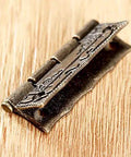 Antique Bronze Iron Hinge Set 36x23mm 10 Pieces Vintage Flower Pattern Decorative Hardware, close-up on wooden surface