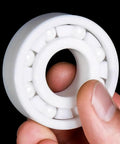 Pro Grade Zirconia Full Ceramic Ball Bearings With Next Level Heat Resistance And Beast Mode Operation For Grind Shop Machines And Hot Rod Builds 6314CE, held in hand.
