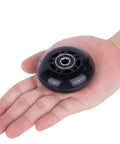 64mm Inline Skate Wheels 82A With ABEC 9 Beefy Bearings 4 Pack For Rollerblade And More shown in hand for size reference