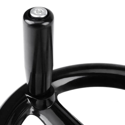 Close-up of Three Spoke Plastic Hand Wheel With Revolving Handle For Milling Machines showing ergonomic black plastic handle
