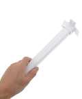 Hand holding a white iron furniture leg from Four Pack Foldable Furniture Legs With Plastic And Iron Frame In White Portable Bed Or Table Leg Set For No Tool Easy Installation Sturdy Replacement Feet For Sofa Cabinet Or Nightstand Great For Small Spaces