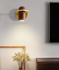 Fly Modern Metal Led Wall Sconce With Bulb Hardcore Adjustable Indoor Reading Lamp Featuring Slick Imitation Wood Grain Finish For Bedroom Kitchen Corridor mounted on wall with golden accents and soft light.