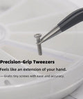 Close-up of tweezers holding a screw from All In One Eyeglass Repair Kit With Anti Slip Nose Pad Replacement And Glasses Screws