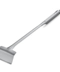 Stainless steel grill spatula with long handle on white background