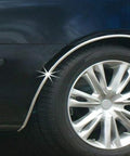Cowles Custom chrome-finish body molding installed on a black car’s side near the wheel arch (side view)