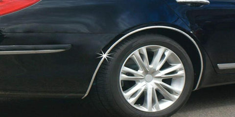 Cowles Custom chrome-finish body molding installed on a black car’s side near the wheel arch (side view)