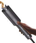 Hand holding Automatic Rotating Curling Iron for Effortless Beachy Waves CurlPRO Wand With Ionic Technology, Ceramic 1 Inch Barrel