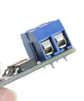 Close-up of Dual High Power MOSFET Trigger Switch Drive Module for PWM, 5V to 36V DC, showing connectors and electronic components.