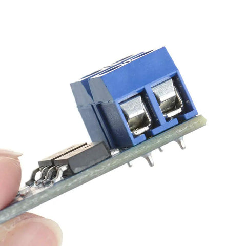 Close-up of Dual High Power MOSFET Trigger Switch Drive Module for PWM, 5V to 36V DC, showing connectors and electronic components.