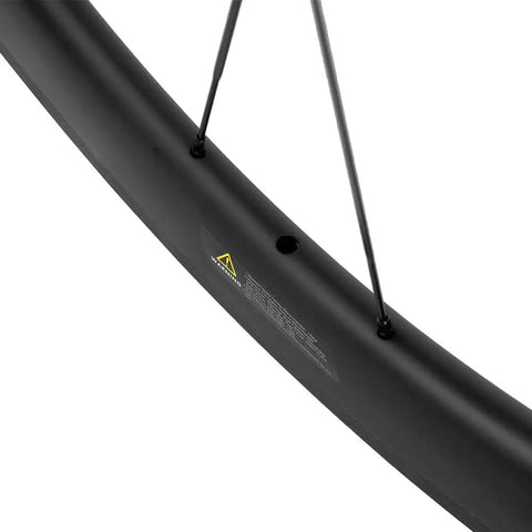 Close-up of 700C Carbon Wheelset Clincher With 50mm Deep UD Matte Finish showing spokes and rim detail, road bike accessory.