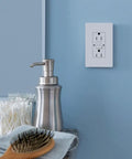 Tamper Resistant GFCI Duplex Receptacle With Test And Reset Button, 15 Amp White Outlet Built For Easy Home Use on blue wall