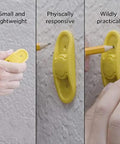 Person using the BSTiltion Magnetic Stud Finder, a small yellow tool, to mark a wall for mounting projects.
