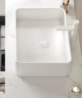 20'' Rectangular Vessel Ceramic Bathroom Sink without Faucet, Striped, White positioned on marble surface with faucet.