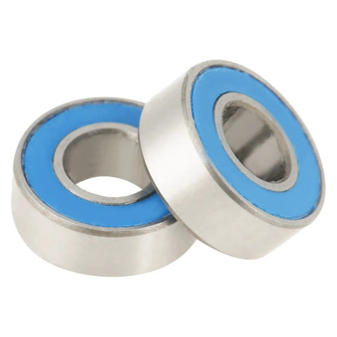 Close-up of two MR115-2RS Blue Beefy 5x11x4mm Skateboard Bearings showing rubber seals and steel material