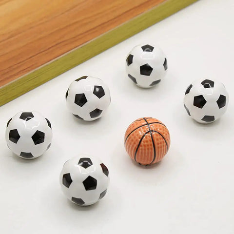 Solid Ceramic Soccer Knobs Four Pack Football Drawer Handles For Kids Bedroom And Man Cave Sports Decor Dresser Cabinet Pulls, six knobs on white background.