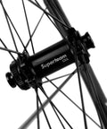 Close-up of hub on 45mm Carbon Tubeless Wheelset For Disc Brake Road Bikes With 25mm Inner Width No Paint Finish Tubeless Ready To Roll Shimano 8 9 10 11 Speed Cassette Body Compatible.