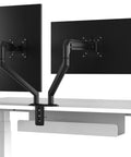 Hella Sturdy Dual Monitor Desk Mount With Super Simple No Drill Install For Thick Tables Rock Solid Clamps holding two monitors.