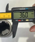 7/8 Inch Female To 3/4 Inch Male Earth Auger Adapter with guide pin being measured with calipers showing 36mm diameter