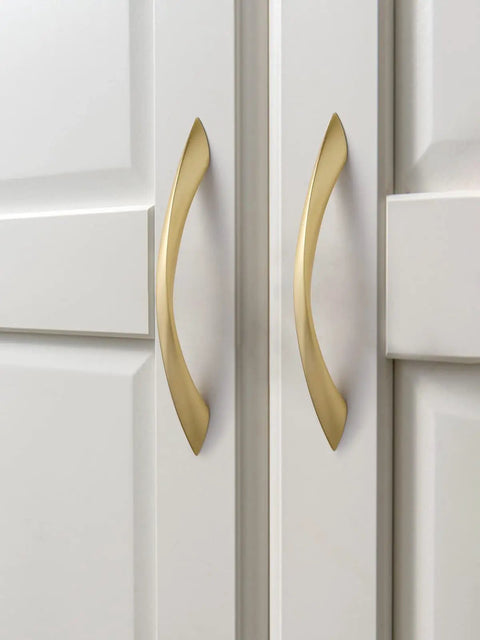Top Notch 5 Inch Arch Cabinet Pulls Featuring Brushed Gold Zinc Alloy Build on white cabinets, enhancing modern decor.