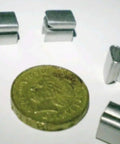 Falconry Telemetry Tailmount And Bell Mount Set, Small 5mm By 7.5mm, 5 Pack Silver, shown with a coin for size comparison