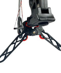 Close-up of Folding Archery Bow Stand For Compound Bows With Non Slip Grip showing base and limb clamp in outdoor setting.