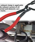 Close-up of exhaust hanger removal pliers with red handles gripping a rubber hanger on a vehicle exhaust.