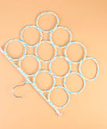 Double Sided Scarf Hanger Closet Organizer Foldable Paper Rattan 12 Ring Tie Holder showing blue and white rattan rings with steel hook.