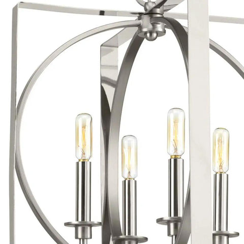 Inman Collection Four-Light Polished Nickel Pendant With Satin Nickel Accents, Modern Geometric Rectangle Frame Featuring Circular Accent, No Shade, 16 In Wide By 18-3/8 In High, Uses Four 60-Watt Candelabra Bulbs Not Included, close-up of frame and bulbs.